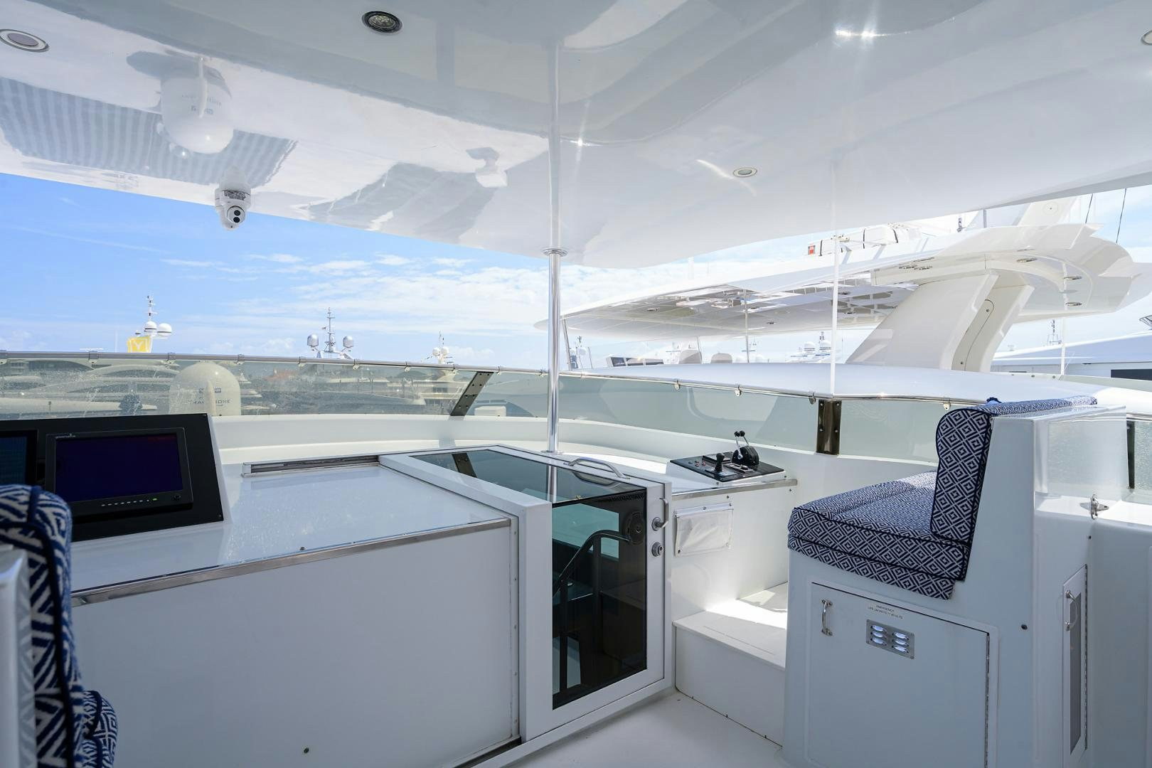 a room with a large window and a desk with computers aboard MEMORYMAKER Yacht for Sale