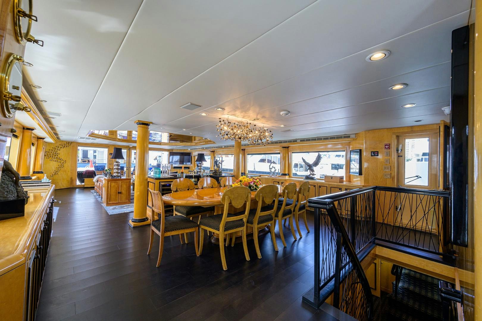 a large room with tables and chairs aboard MEMORYMAKER Yacht for Sale