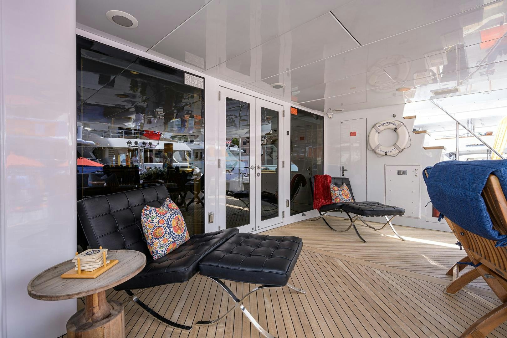 a living room with a couch and a table aboard MEMORYMAKER Yacht for Sale