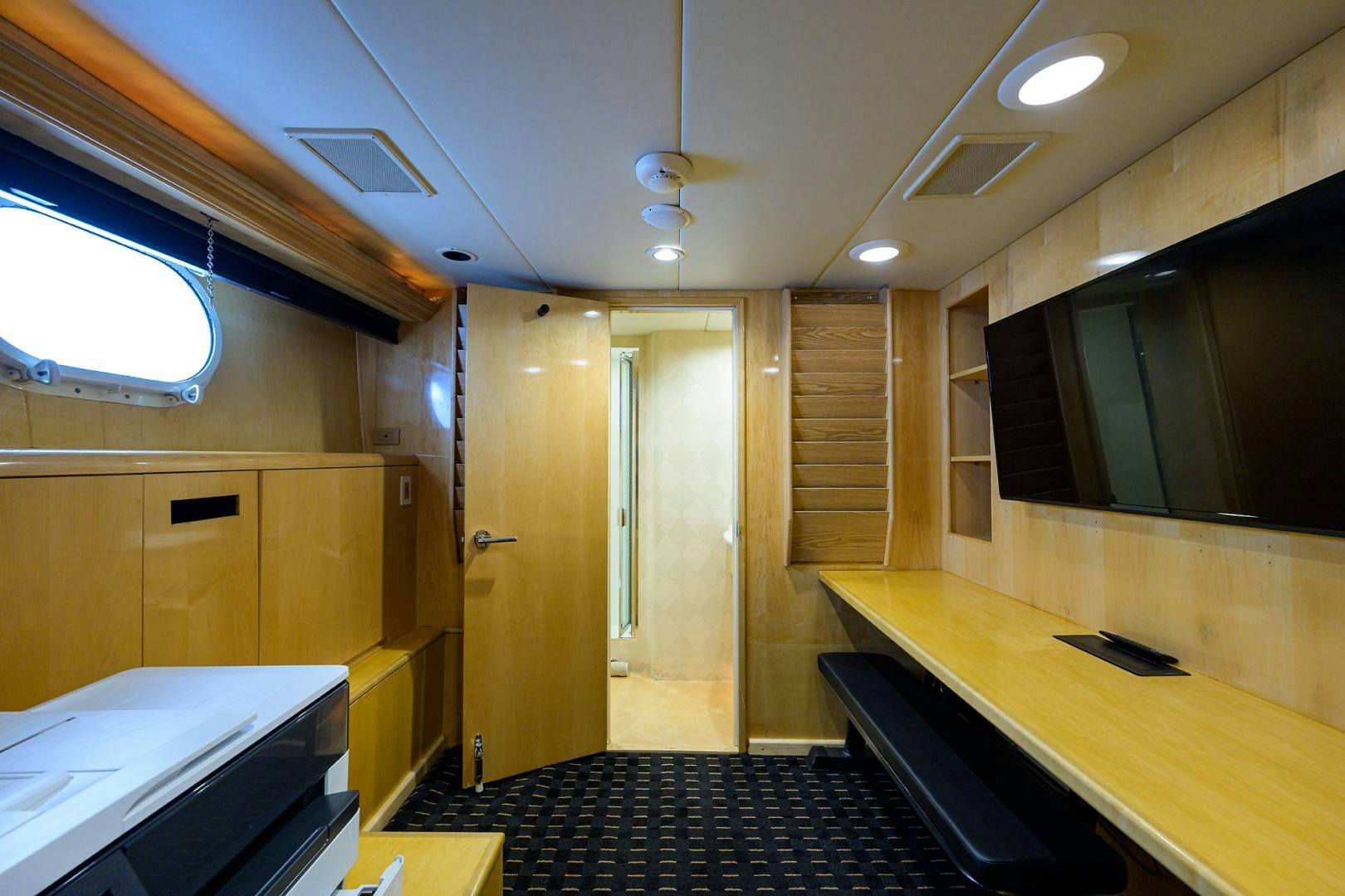 a room with a desk and a window aboard MEMORYMAKER Yacht for Sale