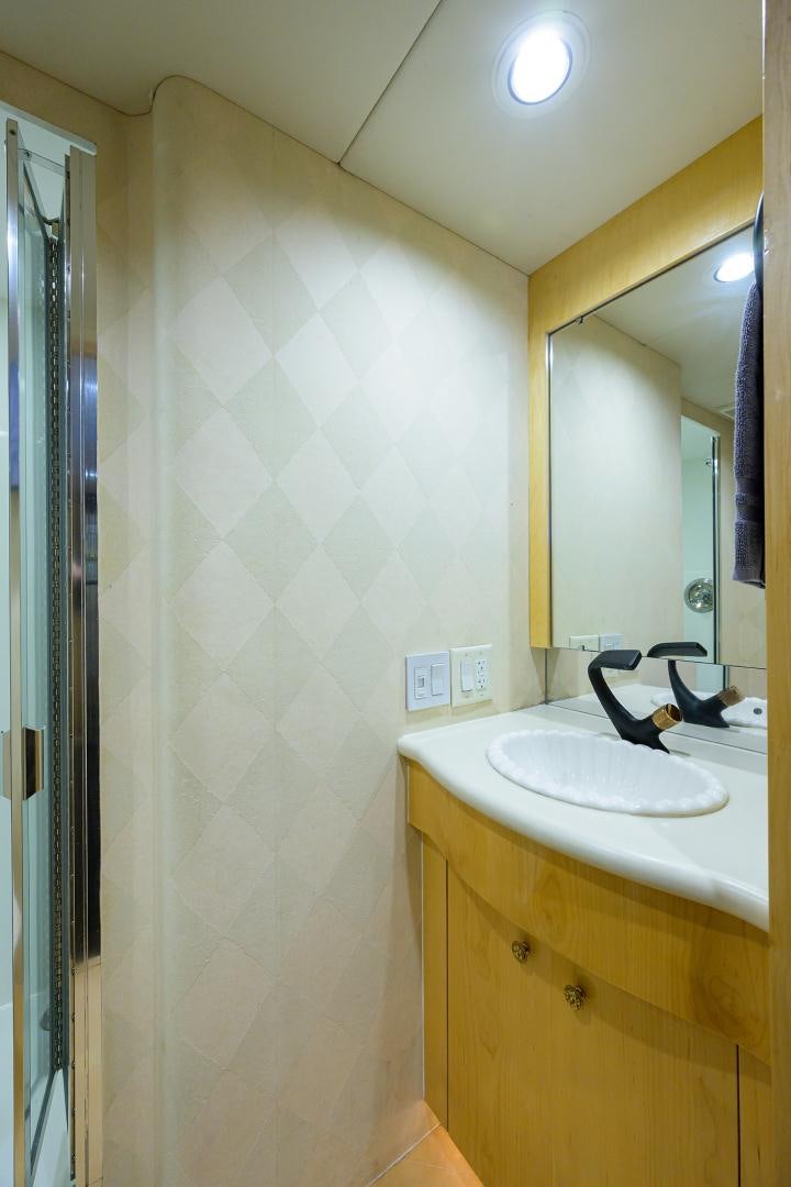 a bathroom with a sink and a mirror aboard MEMORYMAKER Yacht for Sale