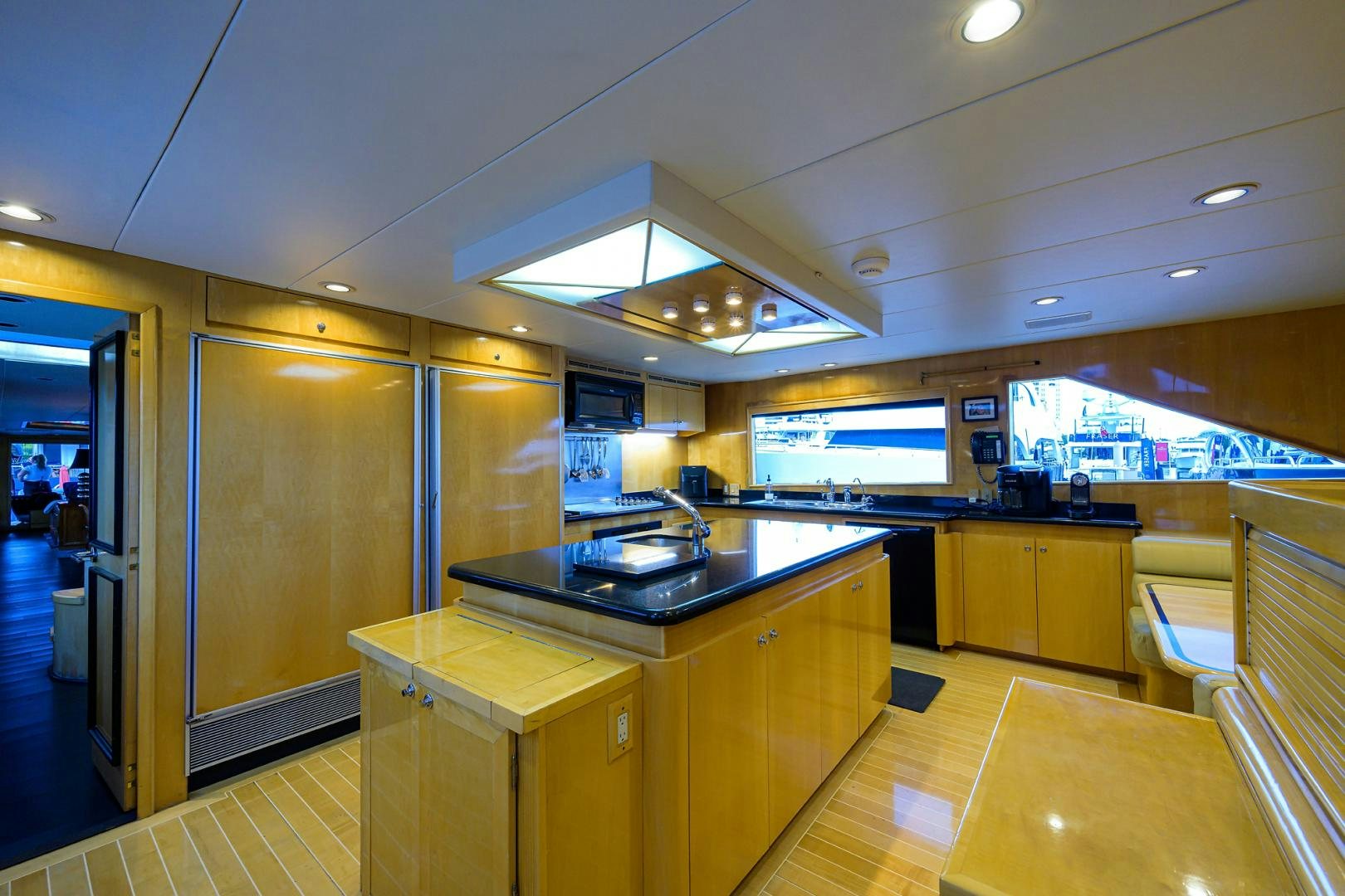 a large kitchen with a large window aboard MEMORYMAKER Yacht for Sale