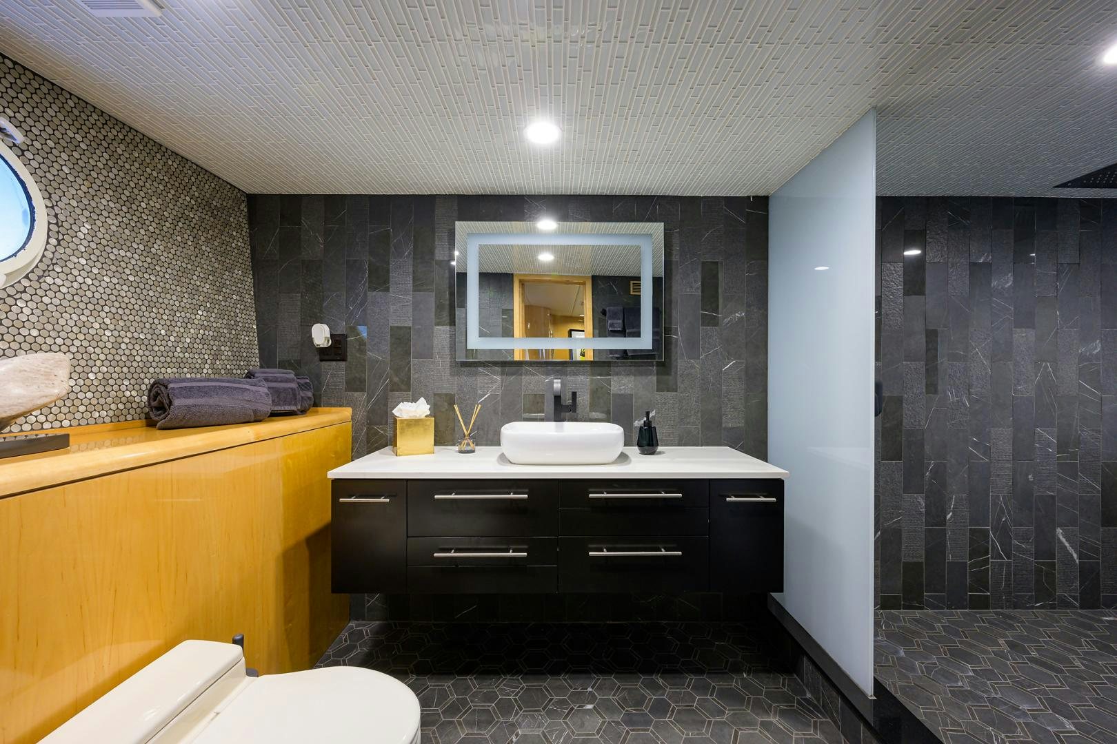 a bathroom with a sink and a mirror aboard MEMORYMAKER Yacht for Sale