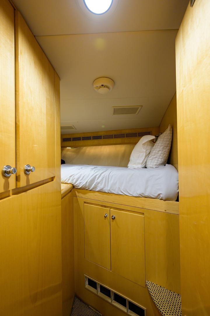 a room with a bed and a closet aboard MEMORYMAKER Yacht for Sale