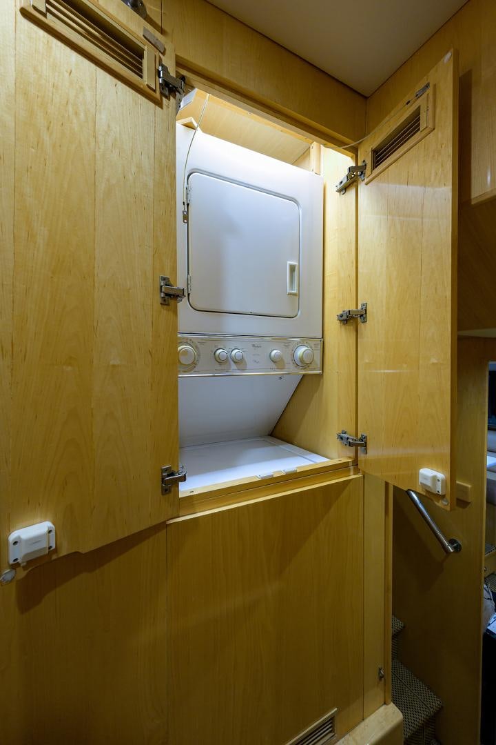 a bathroom with a wooden door aboard MEMORYMAKER Yacht for Sale