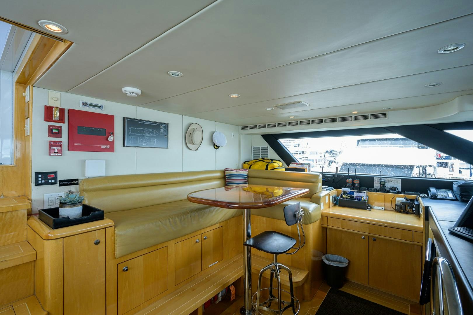 a kitchen with a table and chairs aboard MEMORYMAKER Yacht for Sale