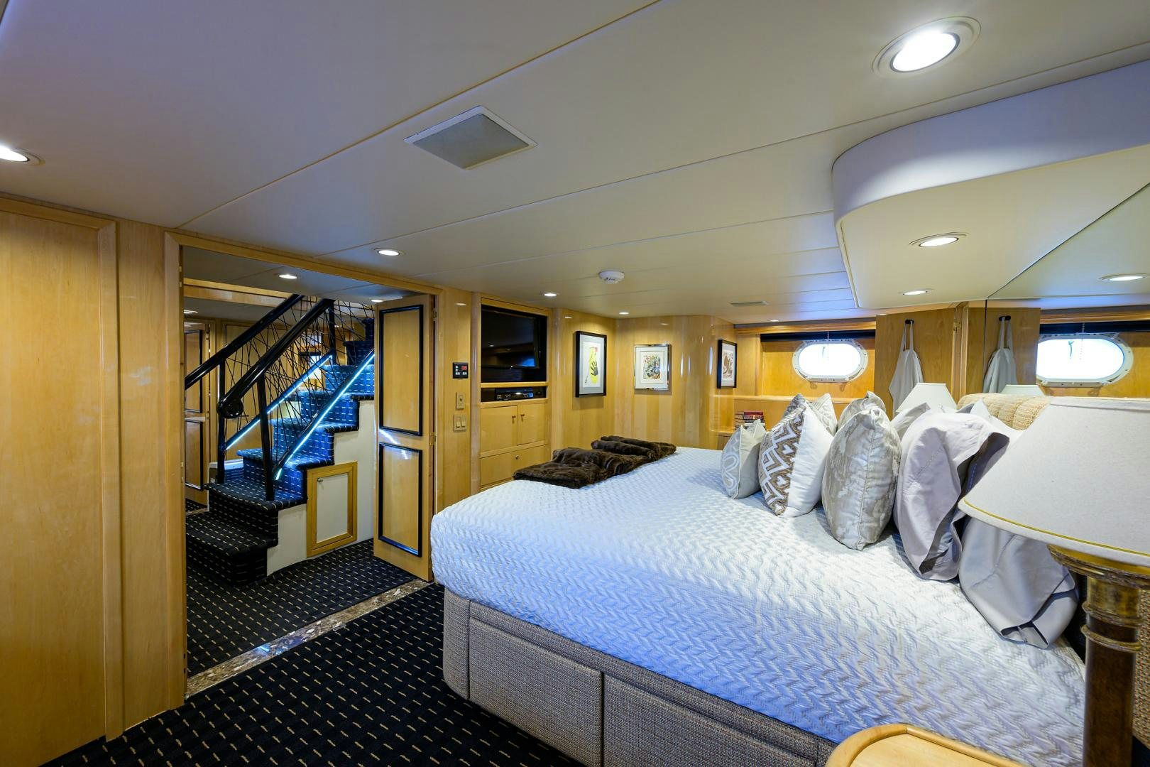 a bedroom with a large bed aboard MEMORYMAKER Yacht for Sale