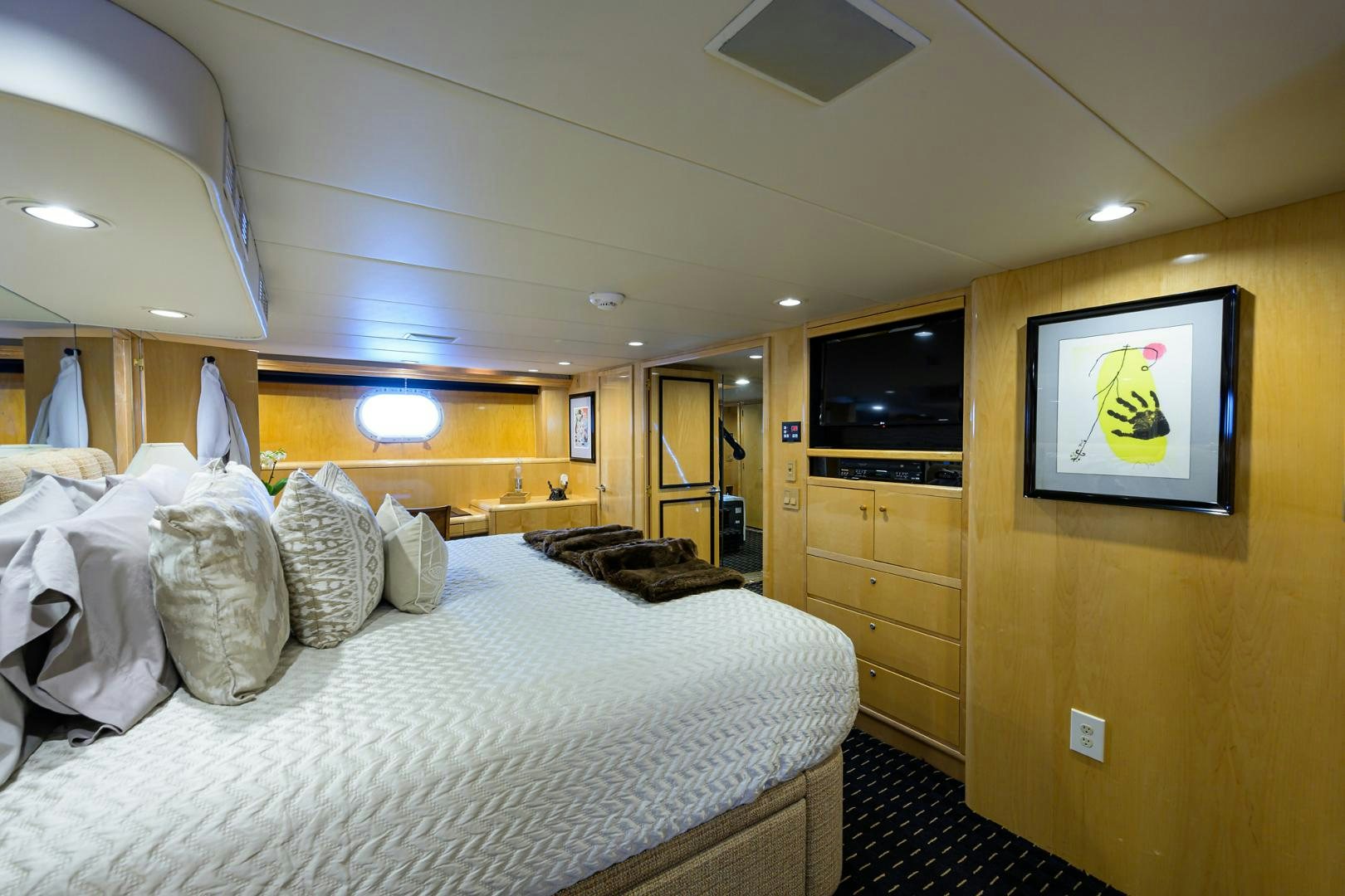 a bedroom with a large bed aboard MEMORYMAKER Yacht for Sale