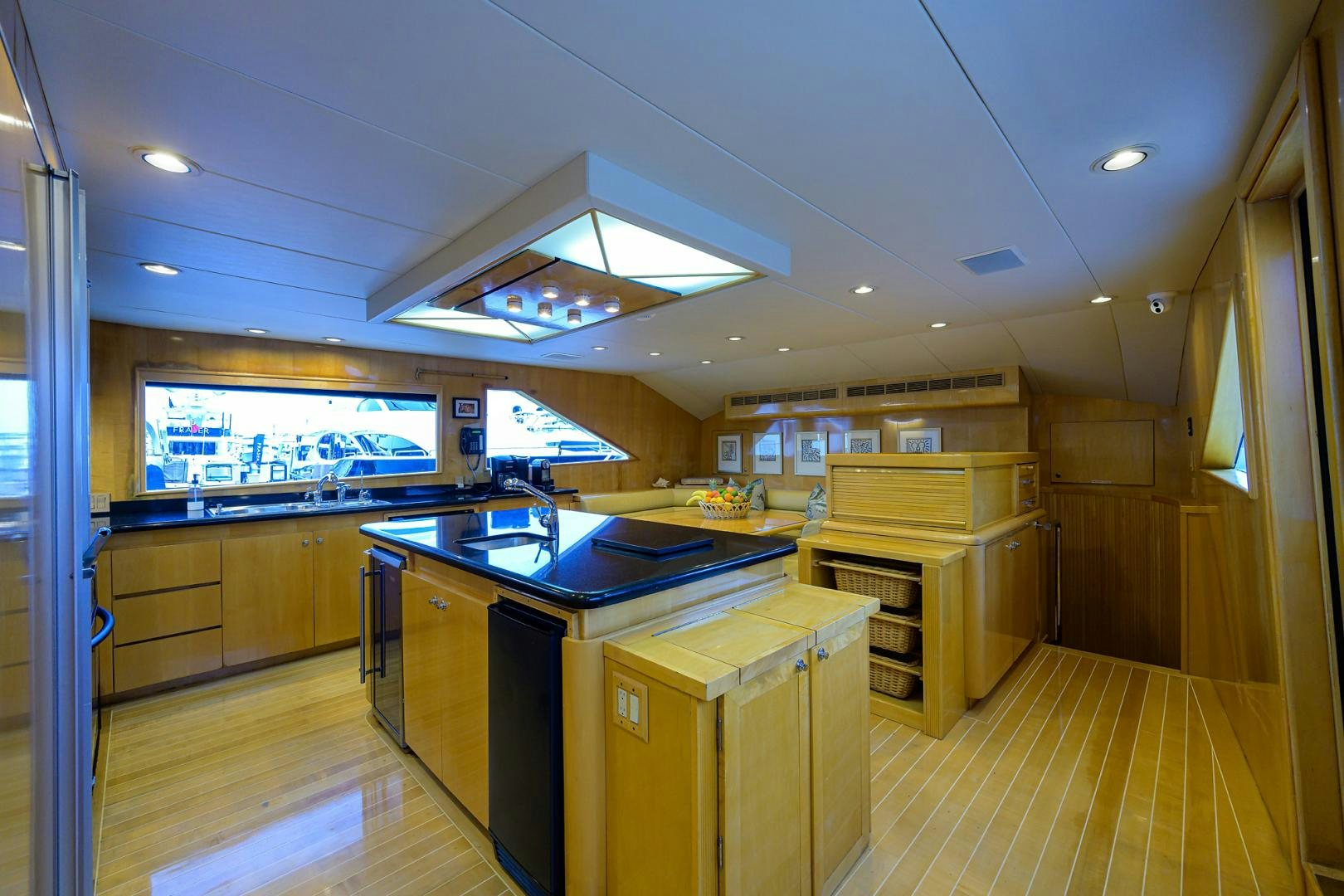 a large kitchen with a large window aboard MEMORYMAKER Yacht for Sale