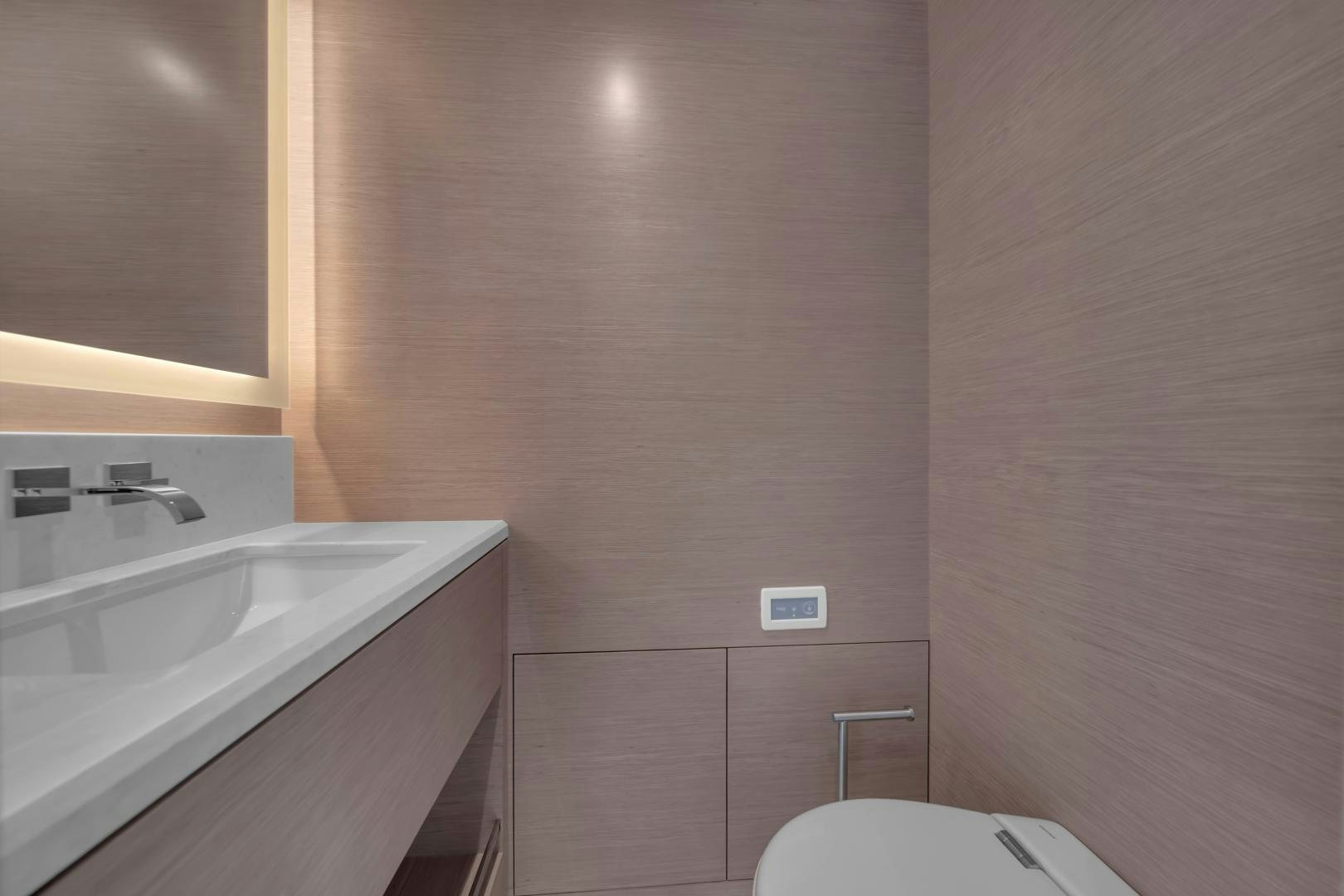 a bathroom with a sink and a toilet aboard CARBON COPY Yacht for Sale