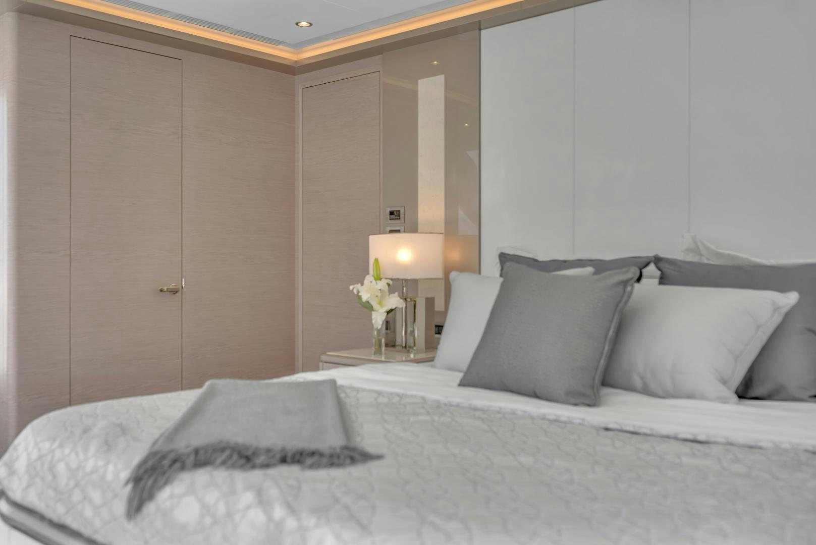 a bed with white sheets and pillows aboard CARBON COPY Yacht for Sale