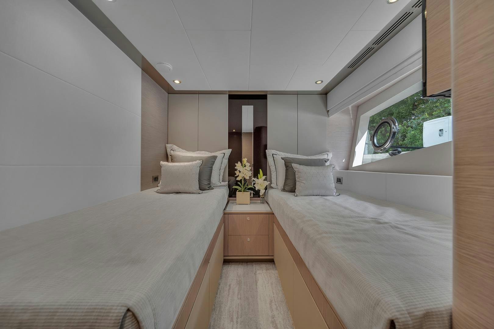 a room with two beds aboard CARBON COPY Yacht for Sale