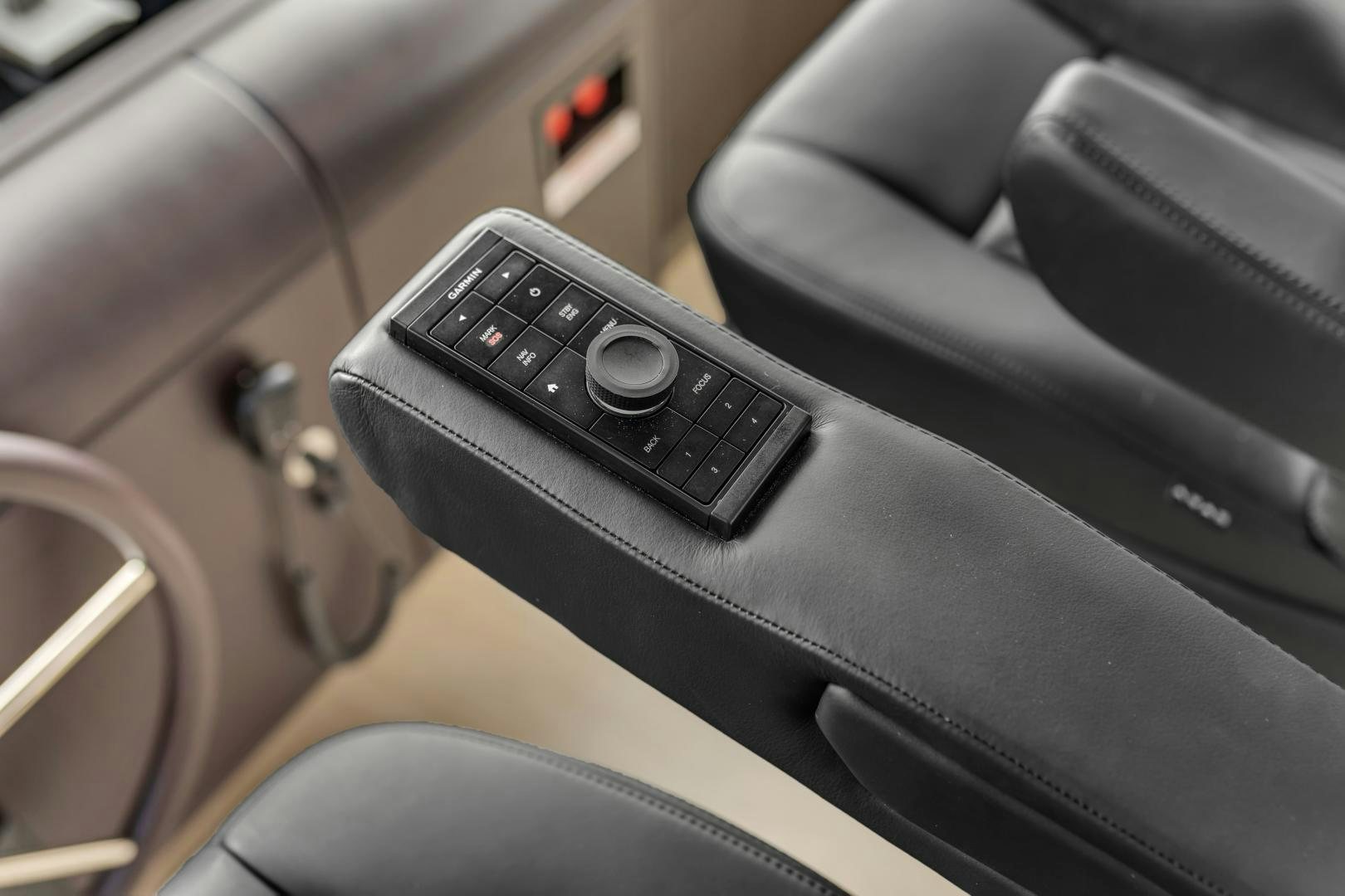 a black phone on a seat aboard CARBON COPY Yacht for Sale