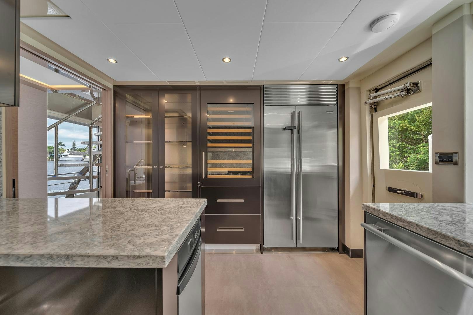 a kitchen with a large island aboard CARBON COPY Yacht for Sale