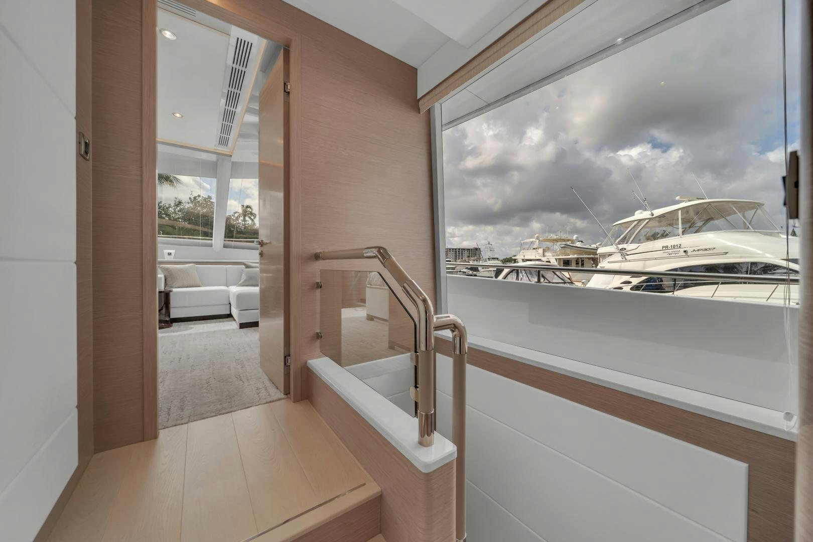 a room with a window and a view of the water aboard CARBON COPY Yacht for Sale