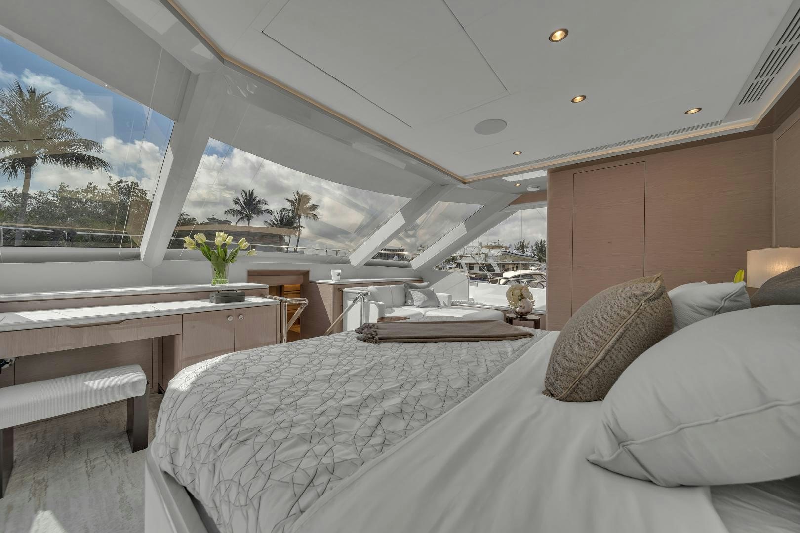a room with a bed and a table aboard CARBON COPY Yacht for Sale