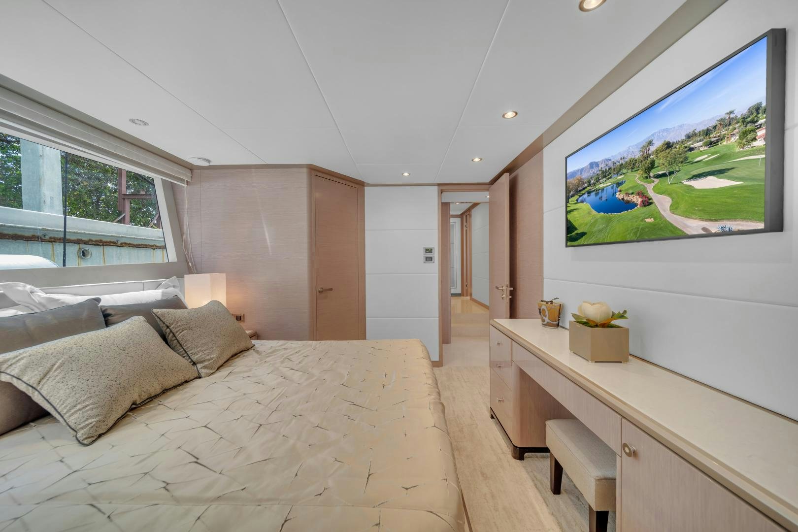 a bedroom with a large bed aboard CARBON COPY Yacht for Sale