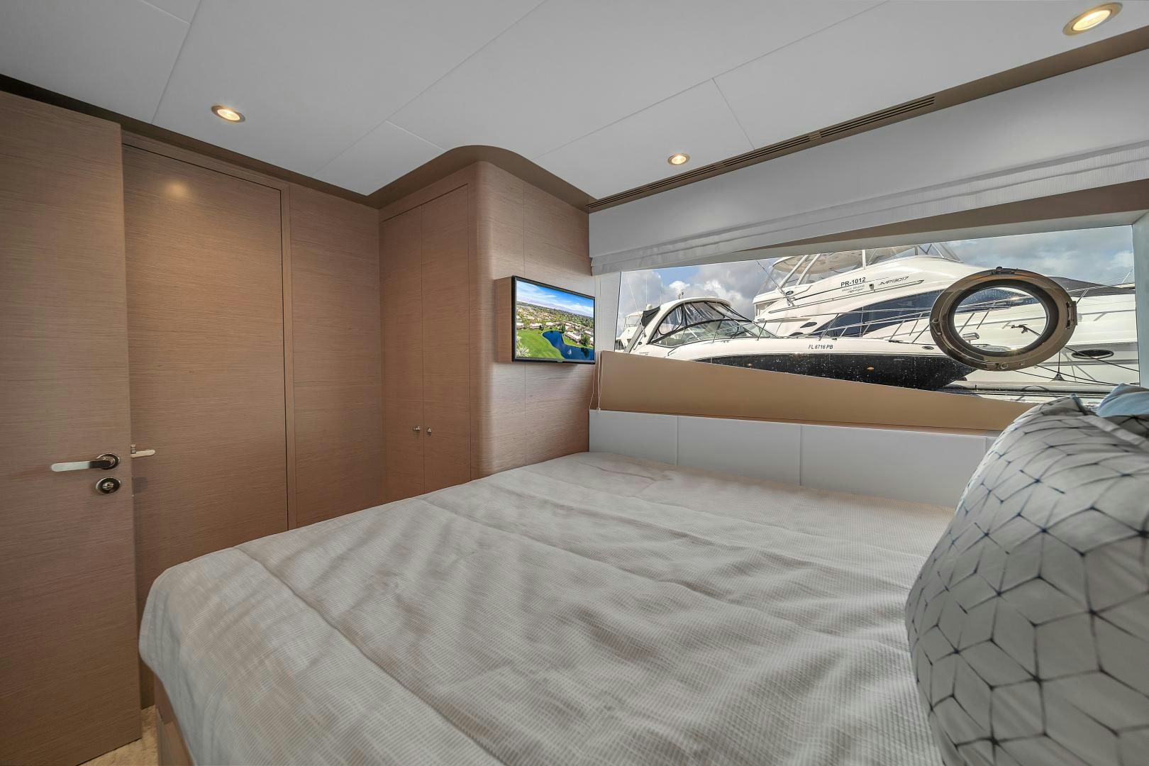 a bedroom with a large bed aboard CARBON COPY Yacht for Sale