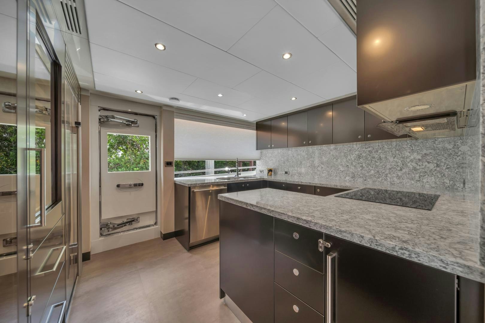 a kitchen with marble counter tops aboard CARBON COPY Yacht for Sale