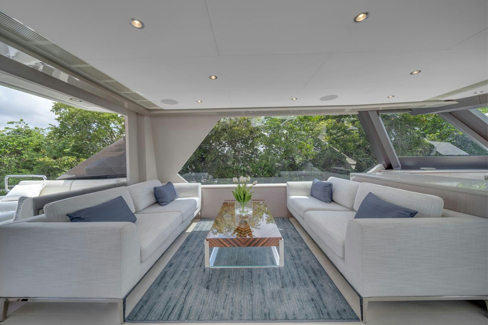 a living room with a couch and a coffee table aboard CARBON COPY Yacht for Sale