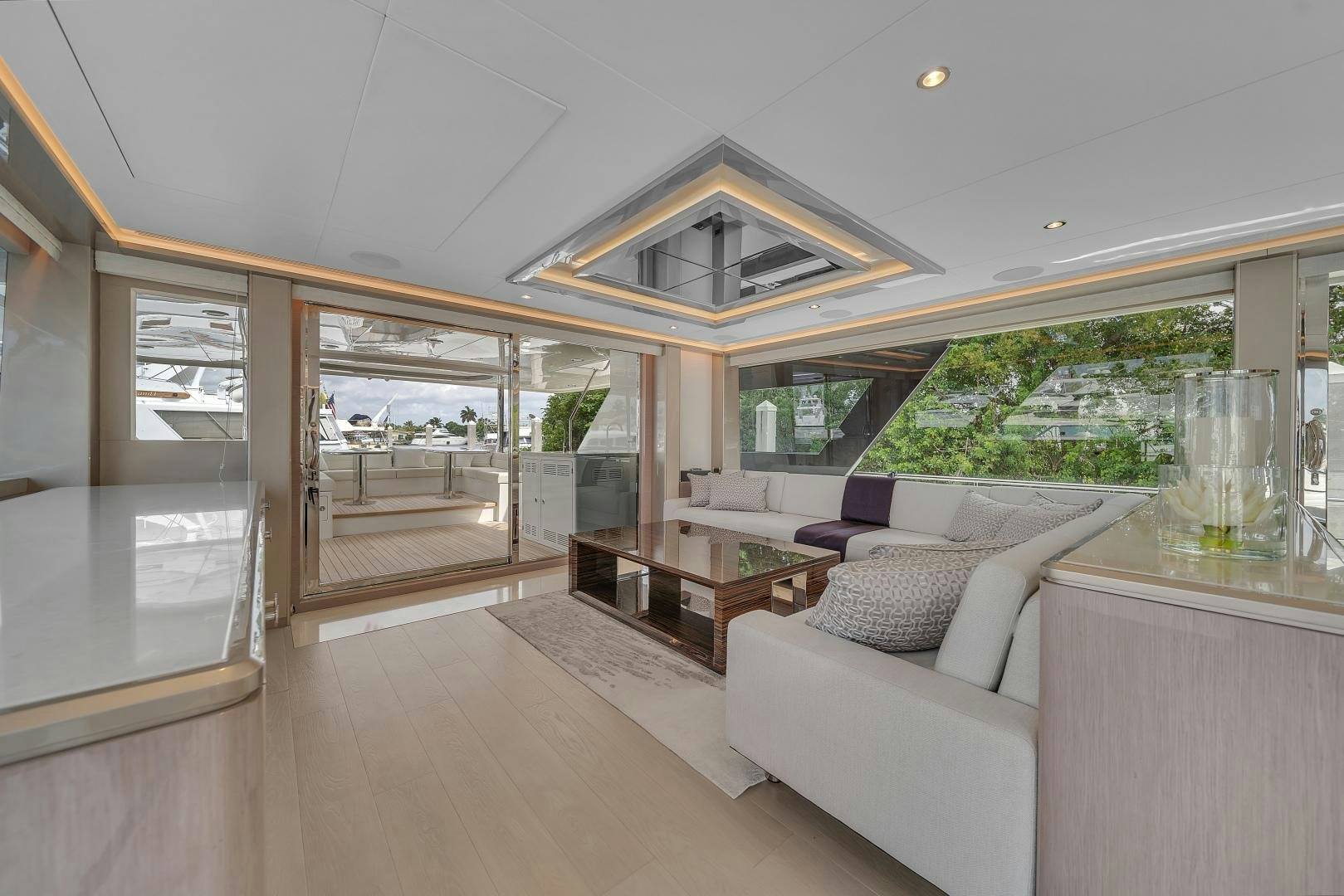 a living room with a glass door aboard CARBON COPY Yacht for Sale