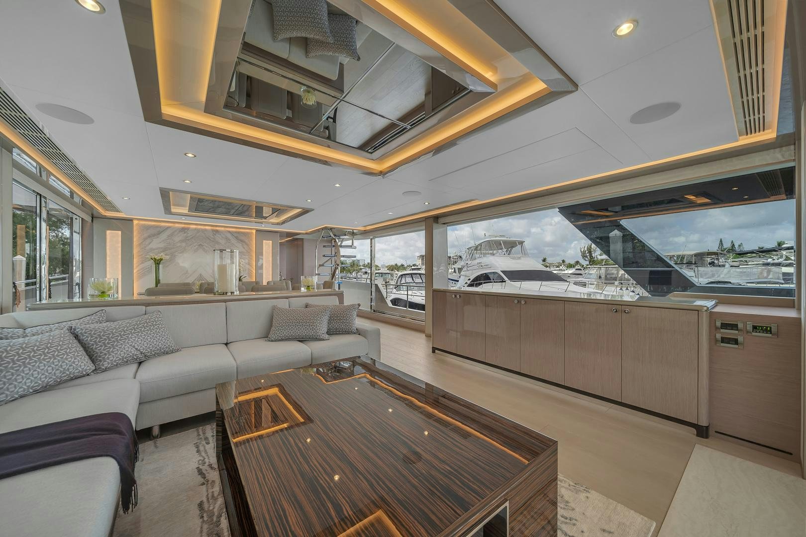 a large living room with a large window aboard CARBON COPY Yacht for Sale