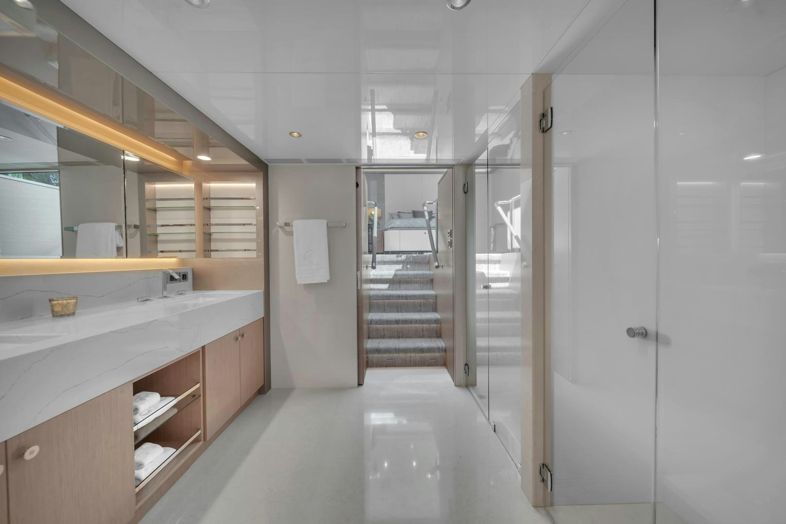 a large bathroom with a large glass shower aboard CARBON COPY Yacht for Sale