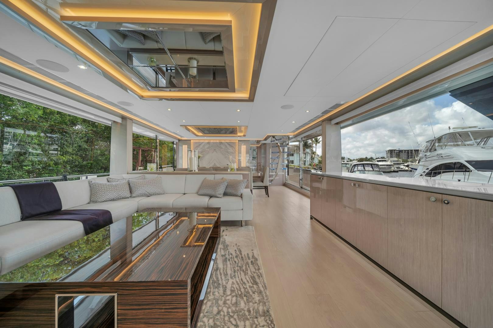a large living room with a large window aboard CARBON COPY Yacht for Sale