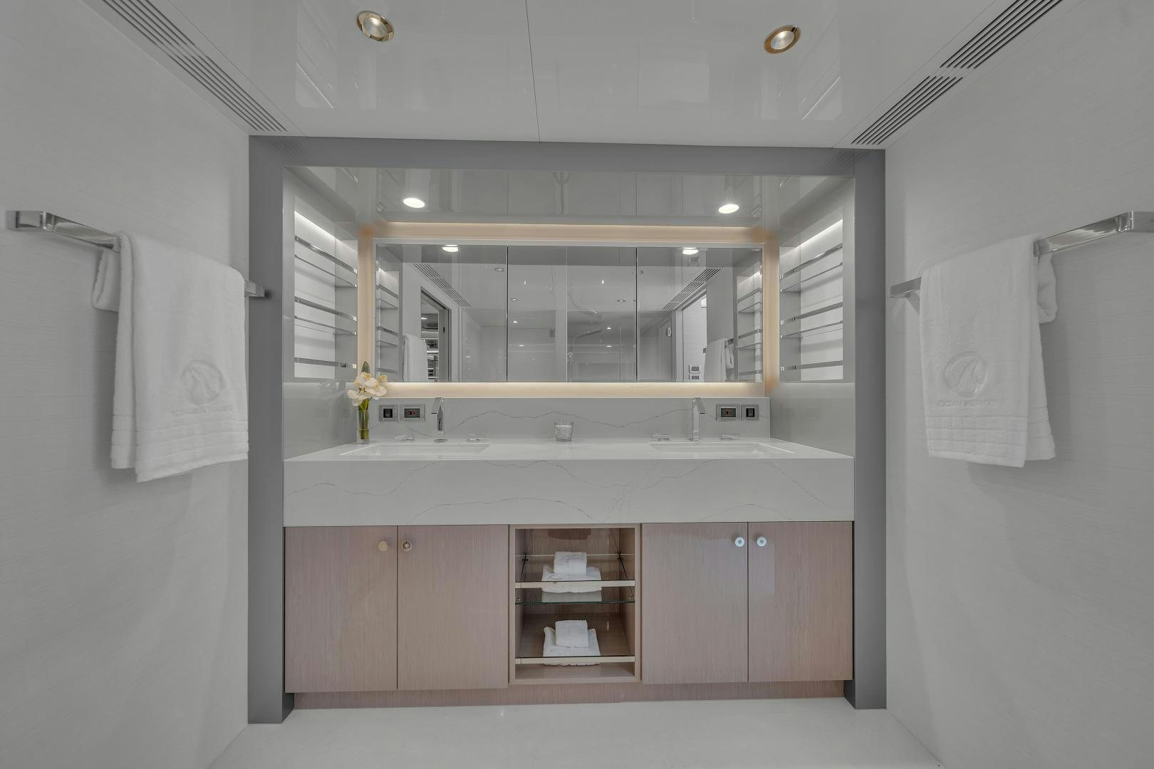 a bathroom with a sink and mirror aboard CARBON COPY Yacht for Sale