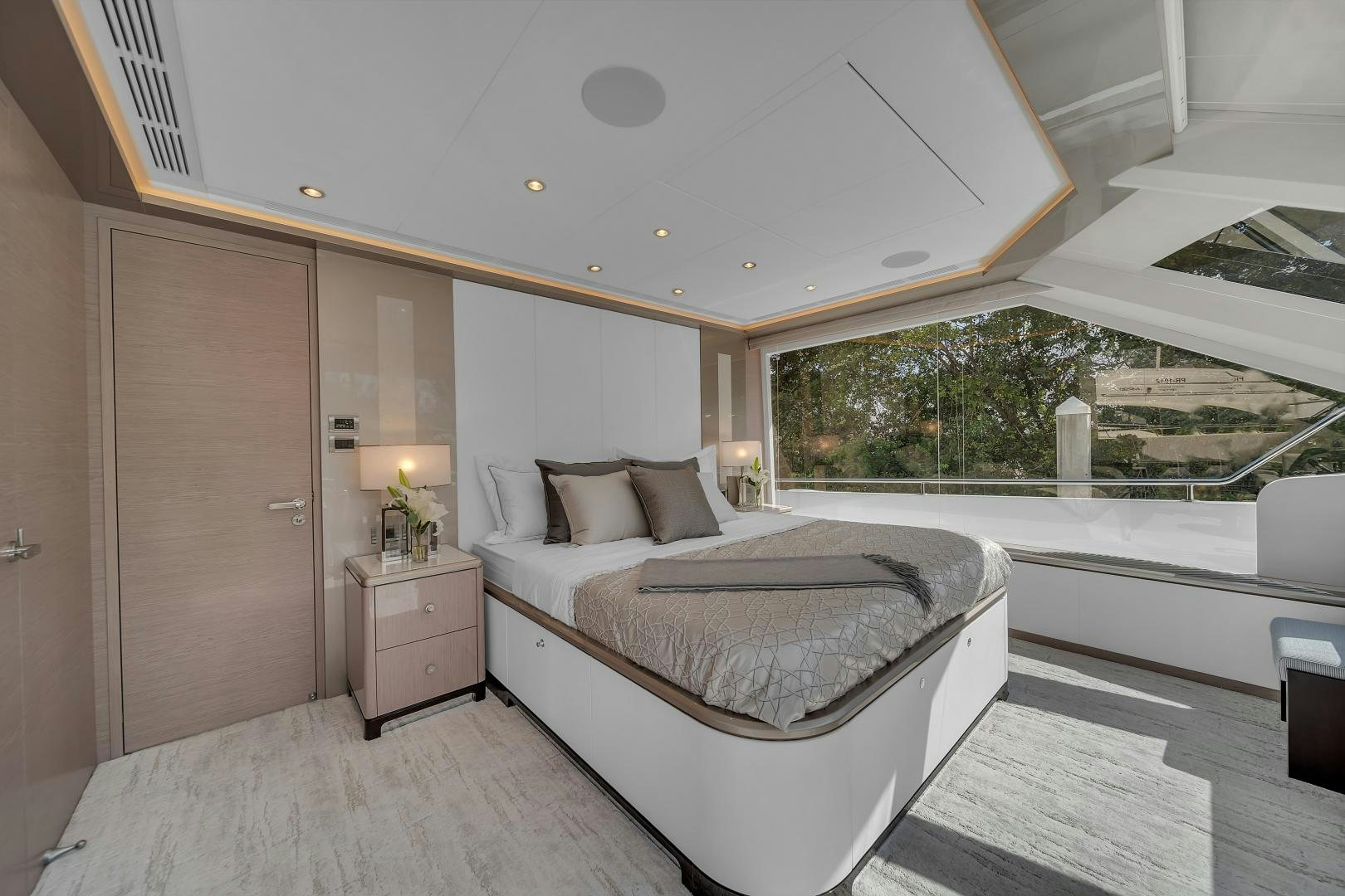 a room with a bed and a window aboard CARBON COPY Yacht for Sale