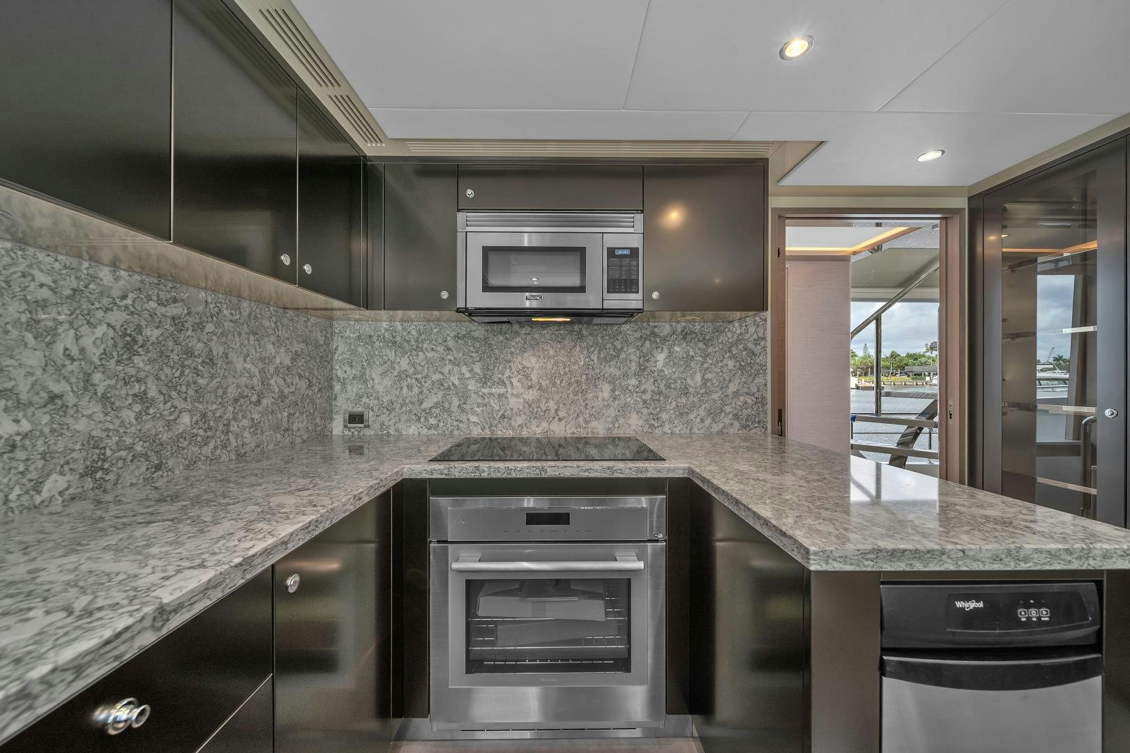 a kitchen with marble counter tops aboard CARBON COPY Yacht for Sale