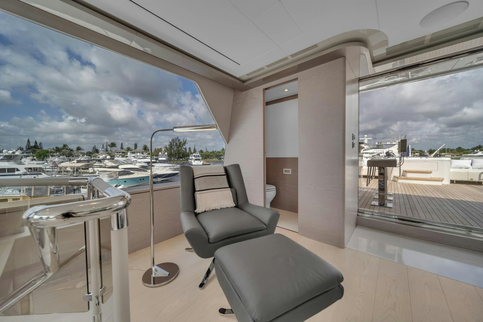 a room with a table chairs and a large window aboard CARBON COPY Yacht for Sale