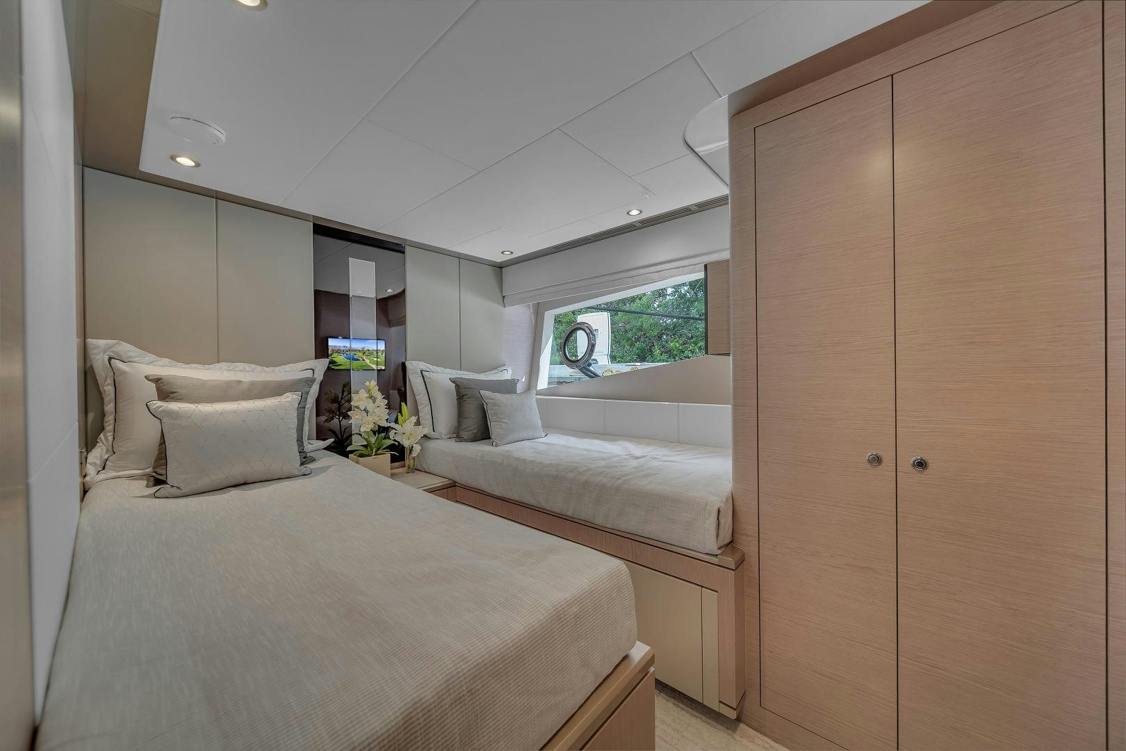 a room with two beds aboard CARBON COPY Yacht for Sale