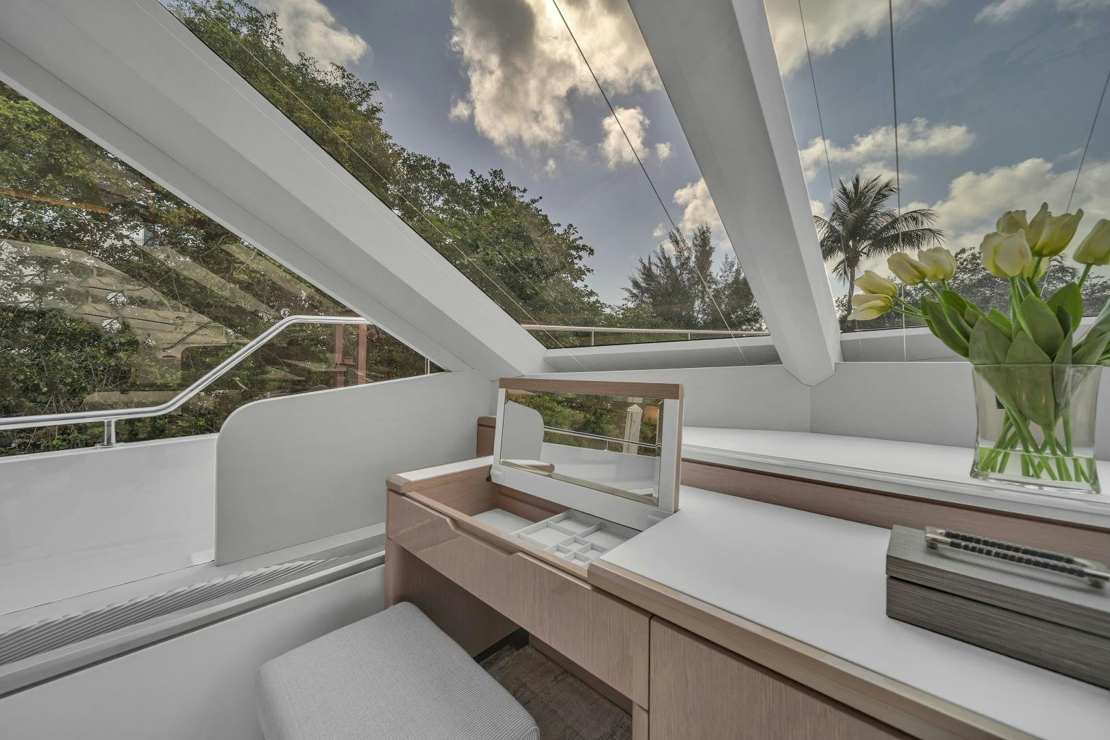 a window with a view of trees and a blue sky aboard CARBON COPY Yacht for Sale