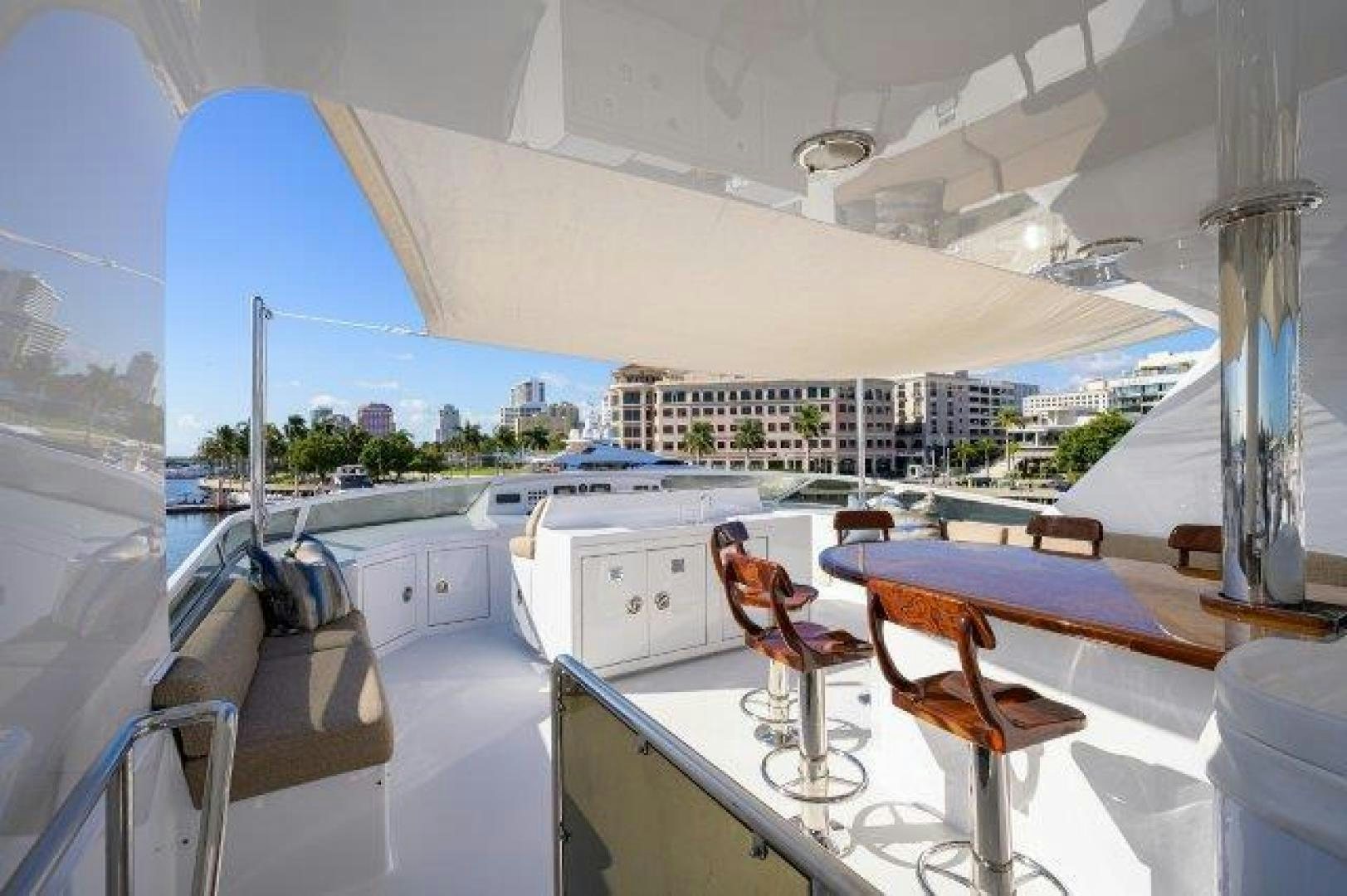 a room with a table and chairs aboard UH OH Yacht for Sale