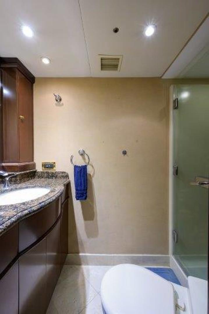 a bathroom with a sink and a toilet aboard UH OH Yacht for Sale