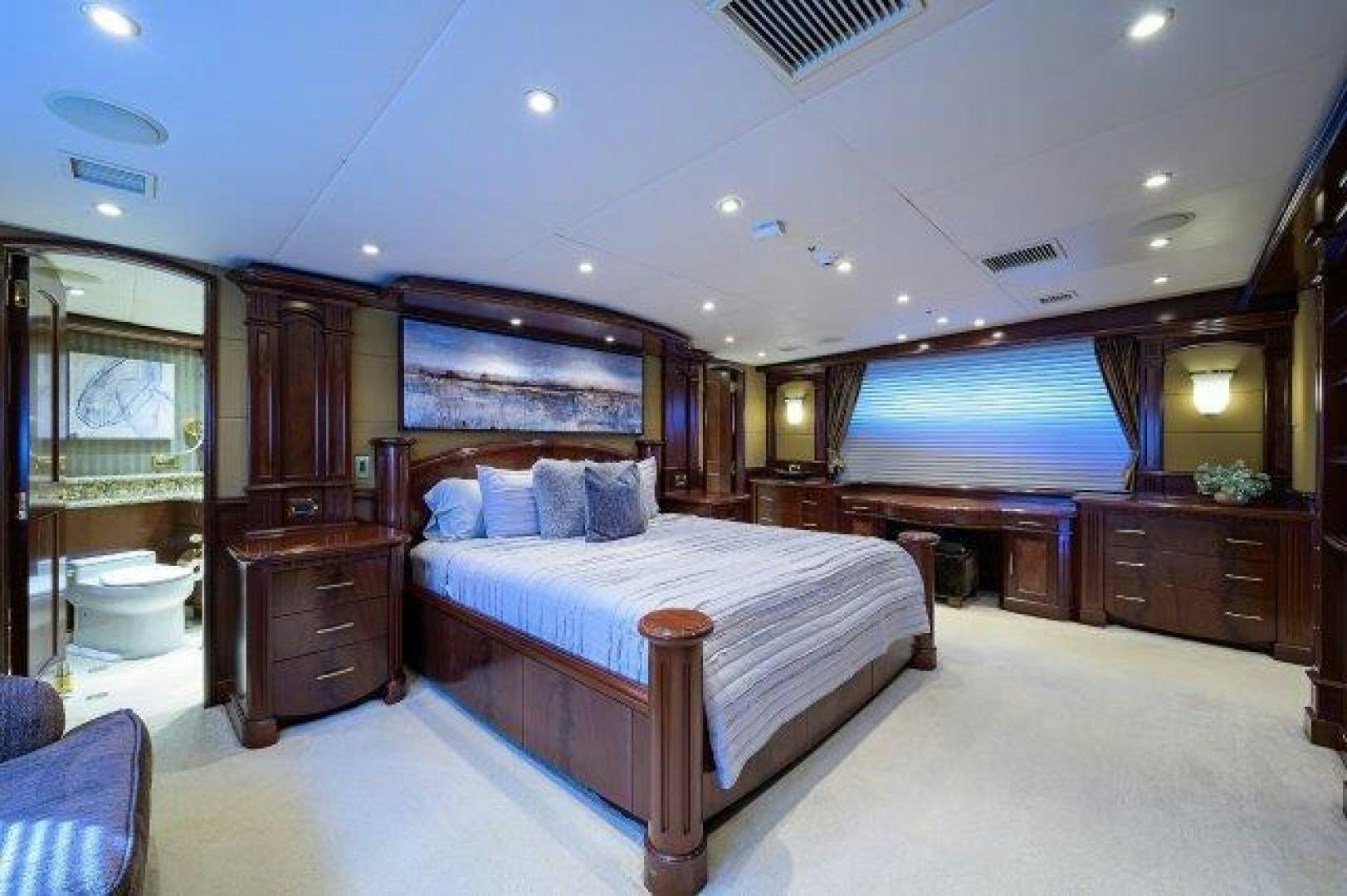 a bedroom with a large bed aboard UH OH Yacht for Sale