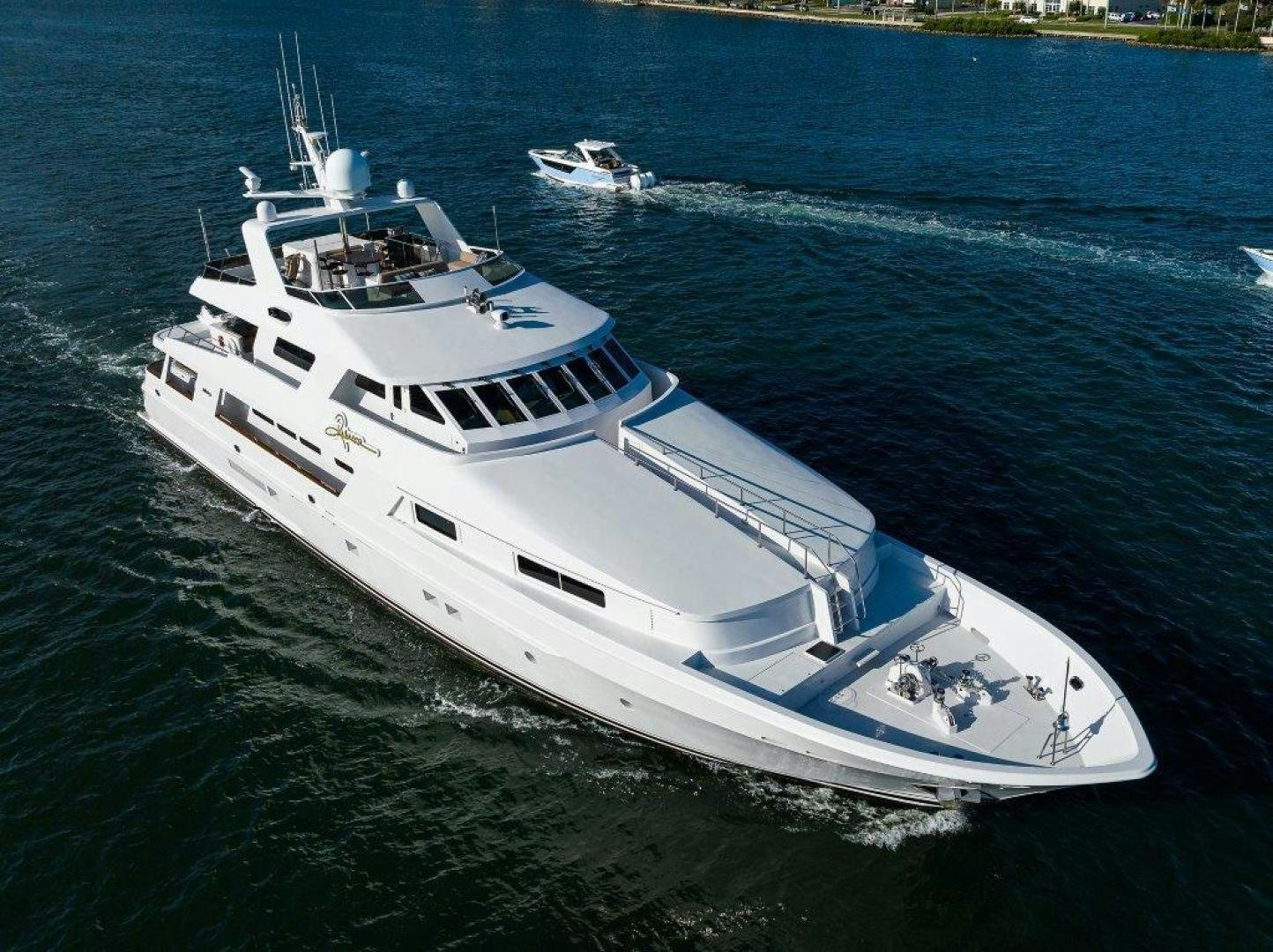 a white boat on the water aboard UH OH Yacht for Sale