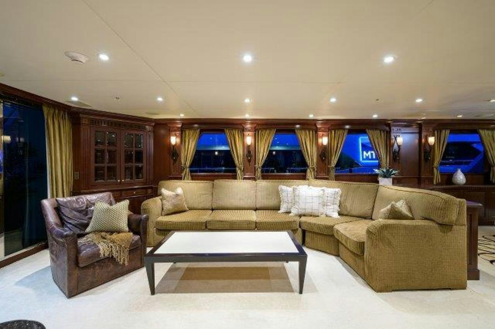 a living room with a large window aboard UH OH Yacht for Sale