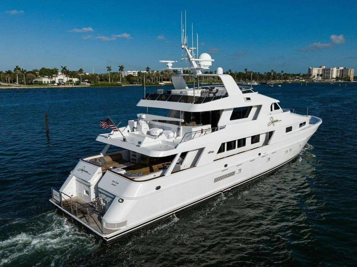 a white yacht on the water aboard UH OH Yacht for Sale