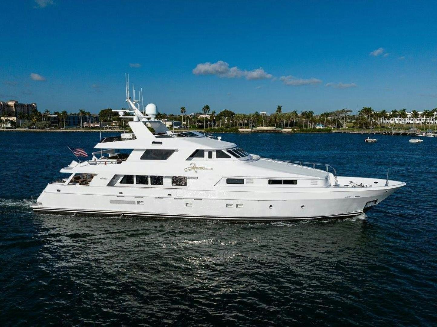 a white yacht in the water aboard UH OH Yacht for Sale