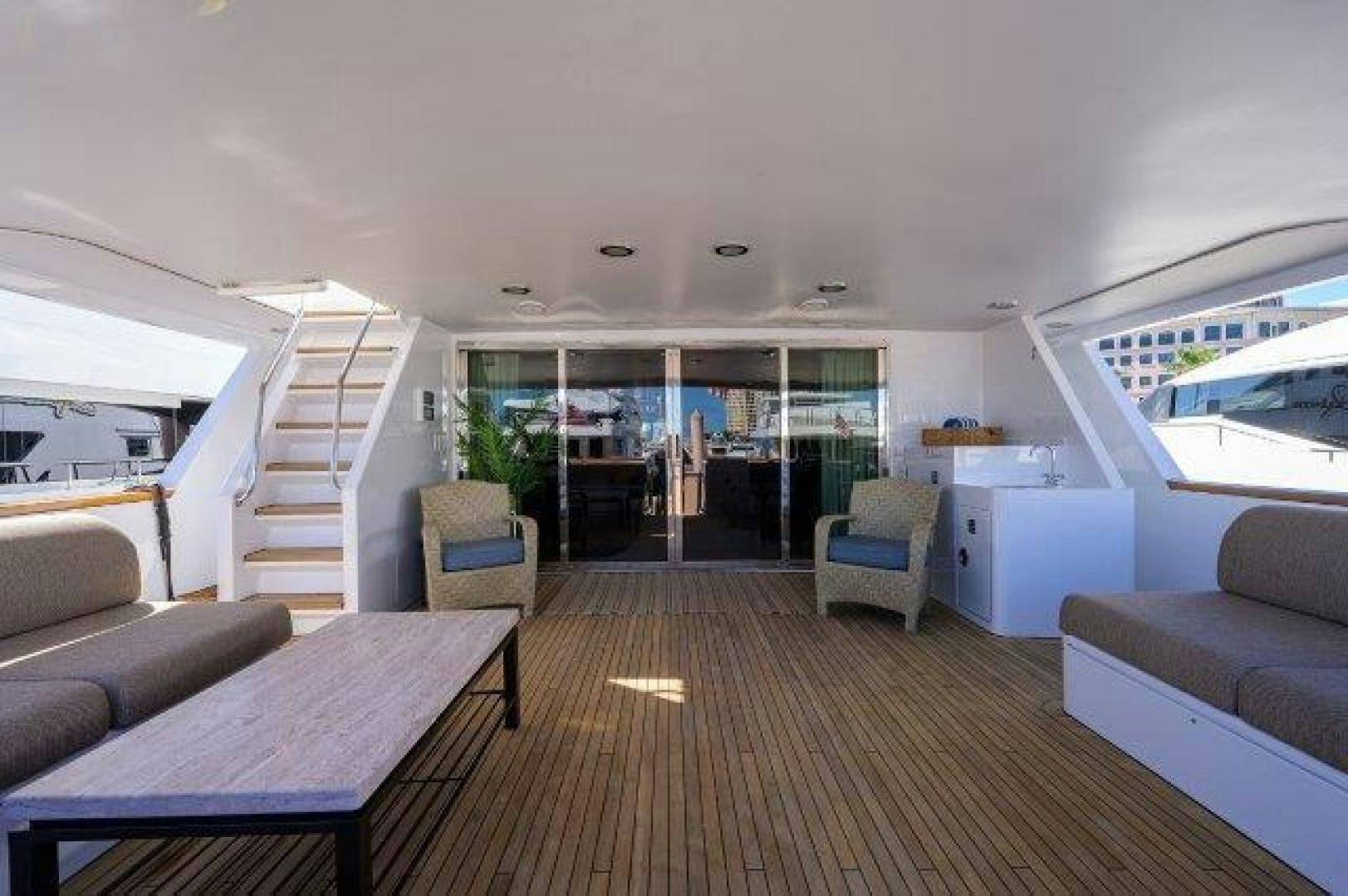 a room with a couch and a table and a chair aboard UH OH Yacht for Sale