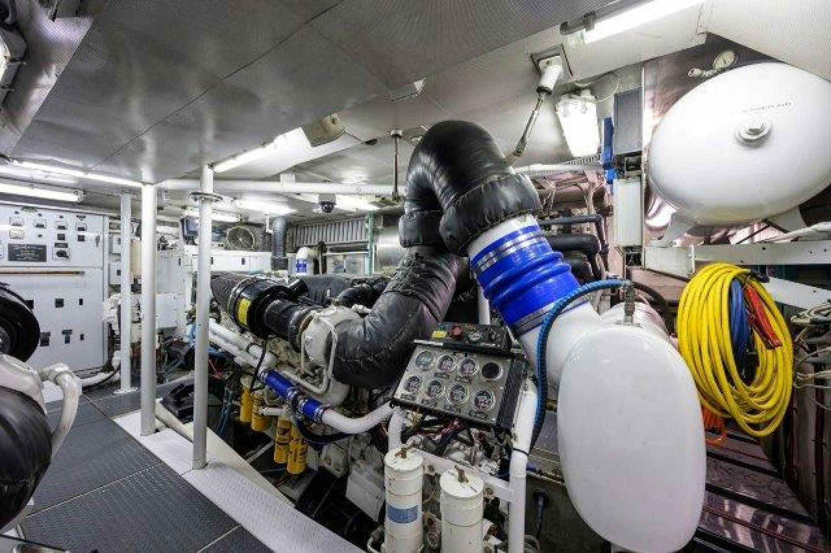 a person working on a machine aboard UH OH Yacht for Sale