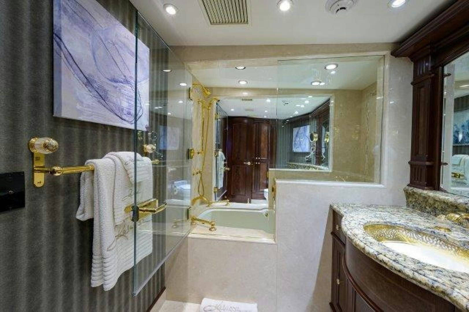 a bathroom with a shower and sink aboard UH OH Yacht for Sale