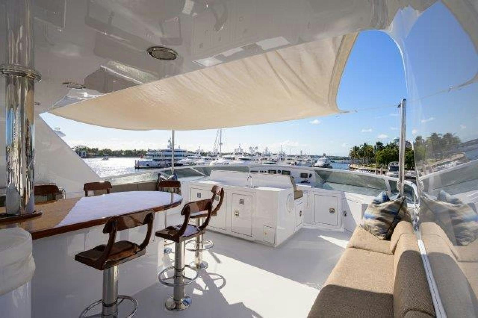 a room with a table and chairs aboard UH OH Yacht for Sale