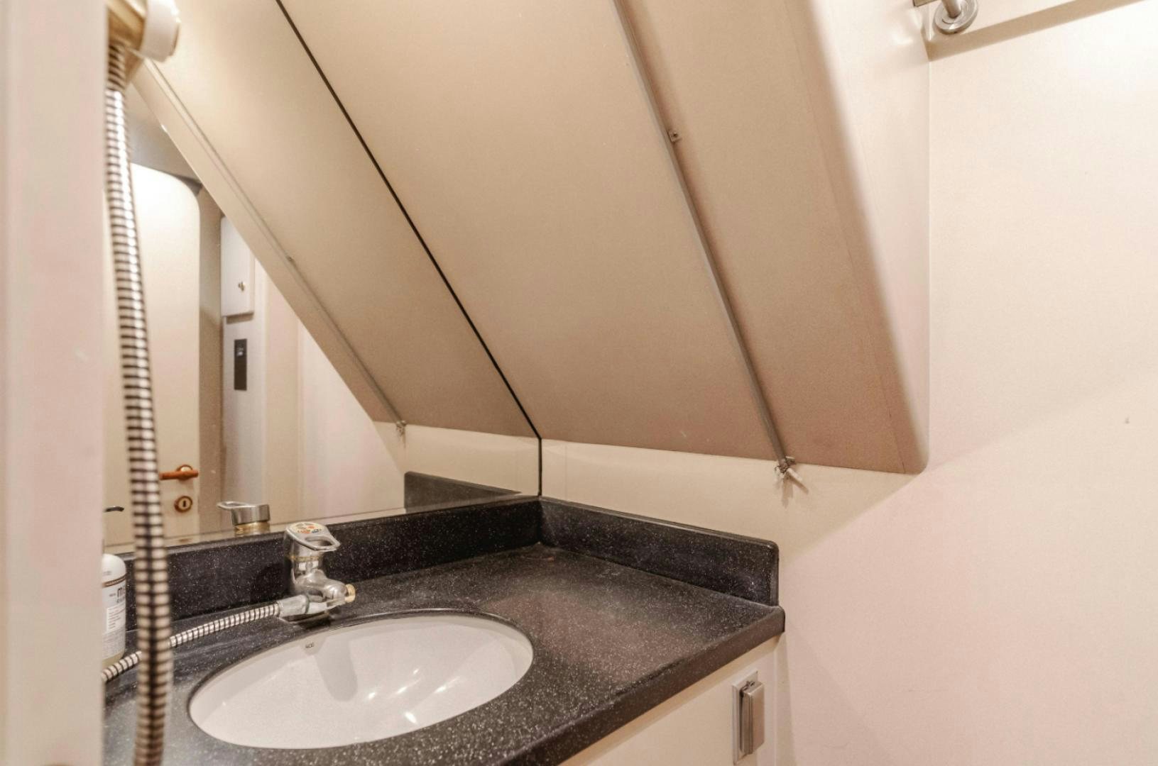 a bathroom with a sink and a mirror aboard MARBELLA Yacht for Sale