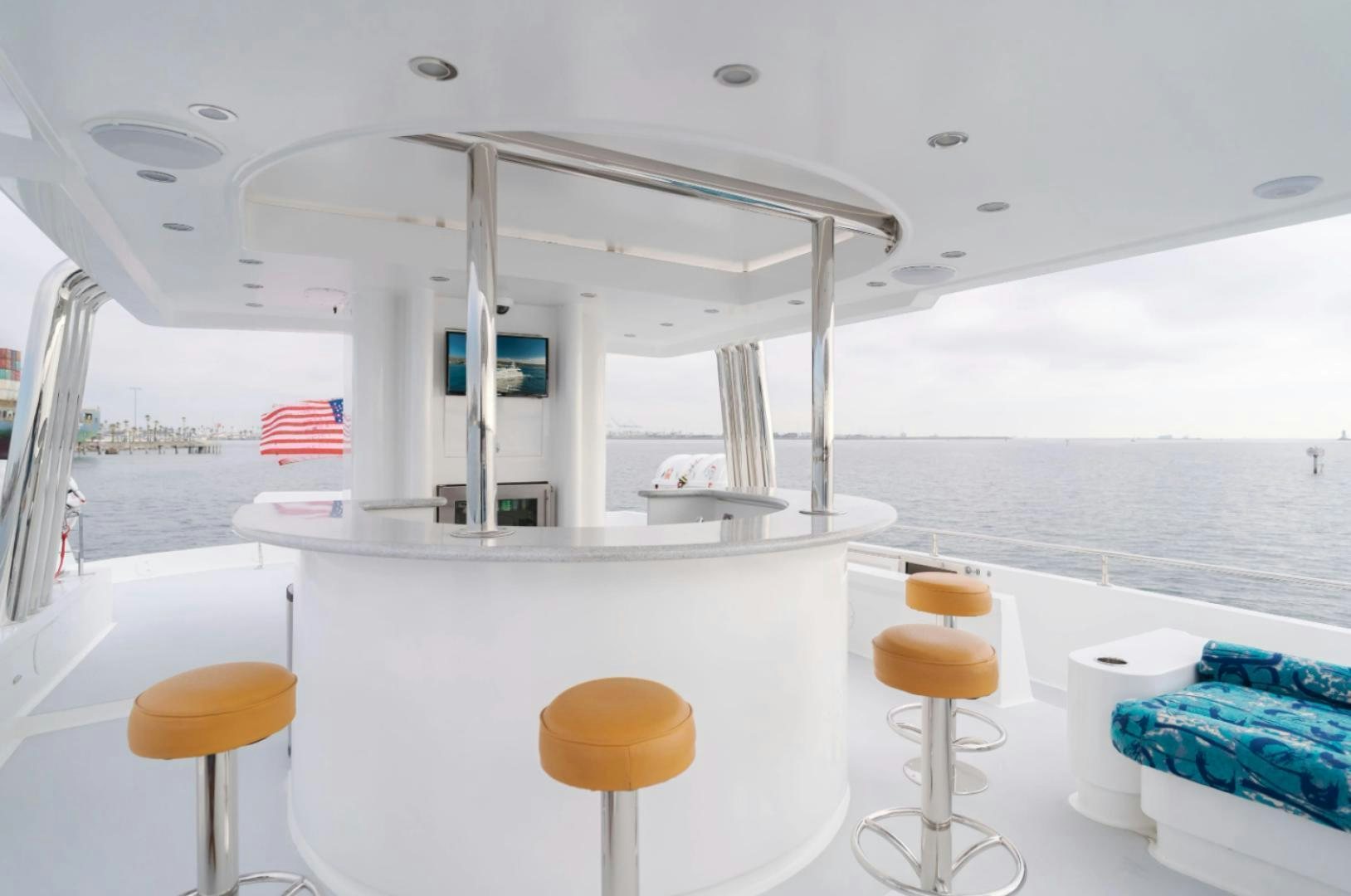 a white boat with stools and stools aboard MARBELLA Yacht for Sale