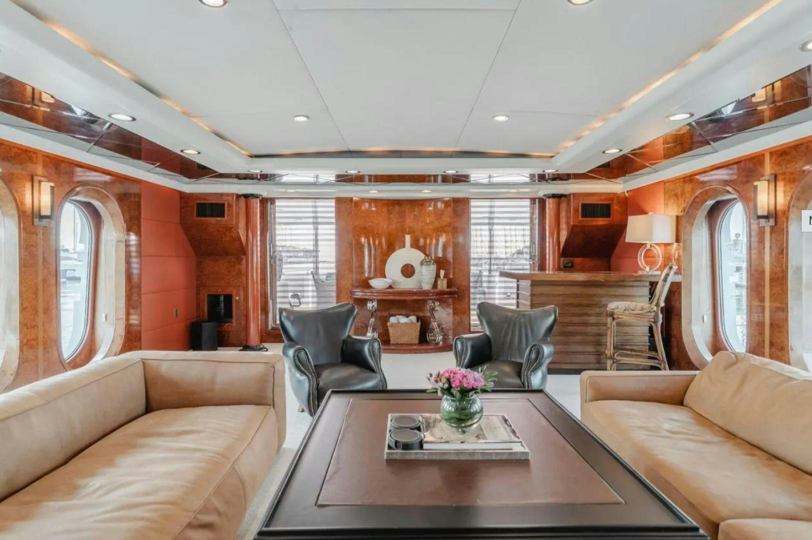 a living room with a table and chairs aboard MARBELLA Yacht for Sale