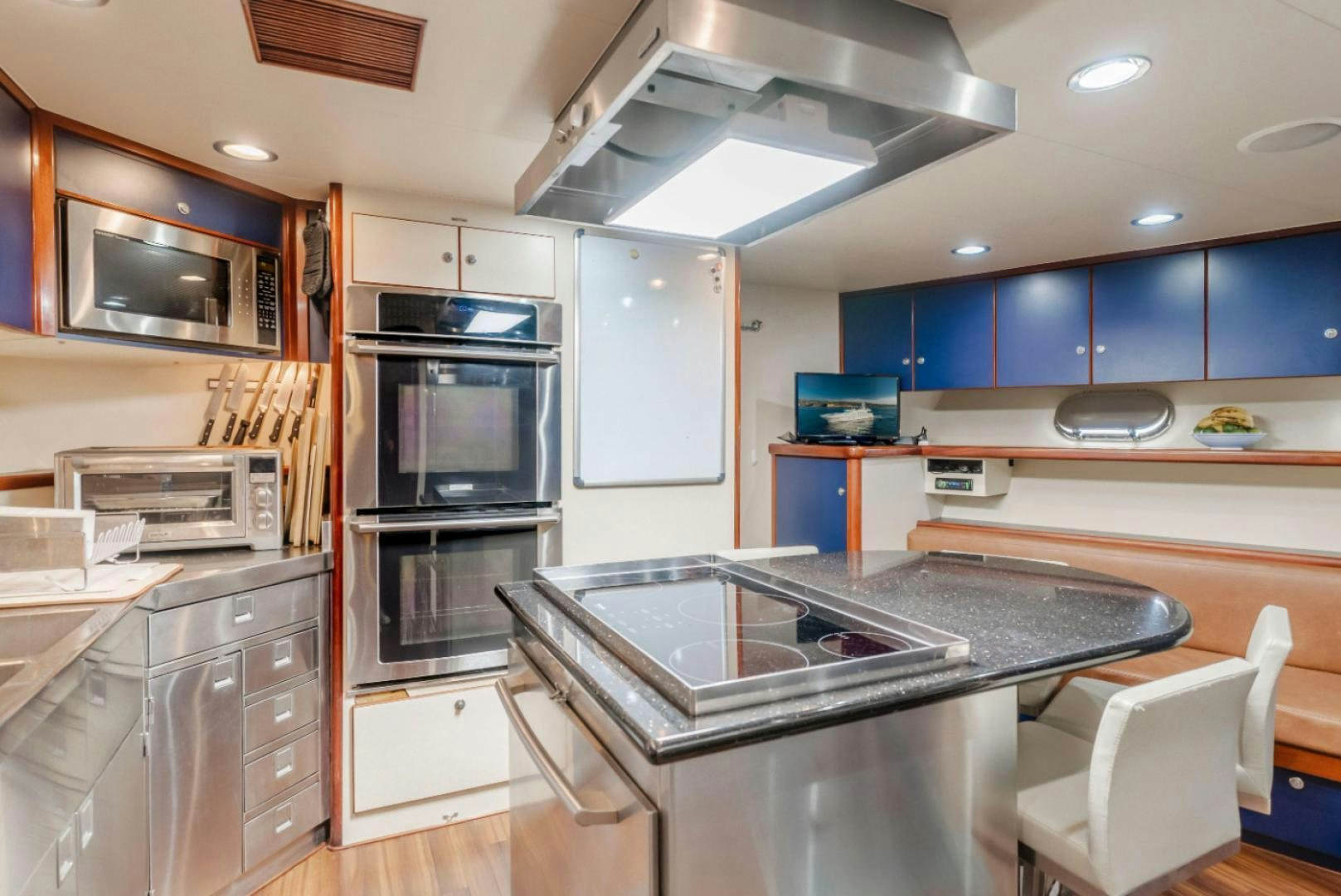 a kitchen with a stove and oven aboard MARBELLA Yacht for Sale