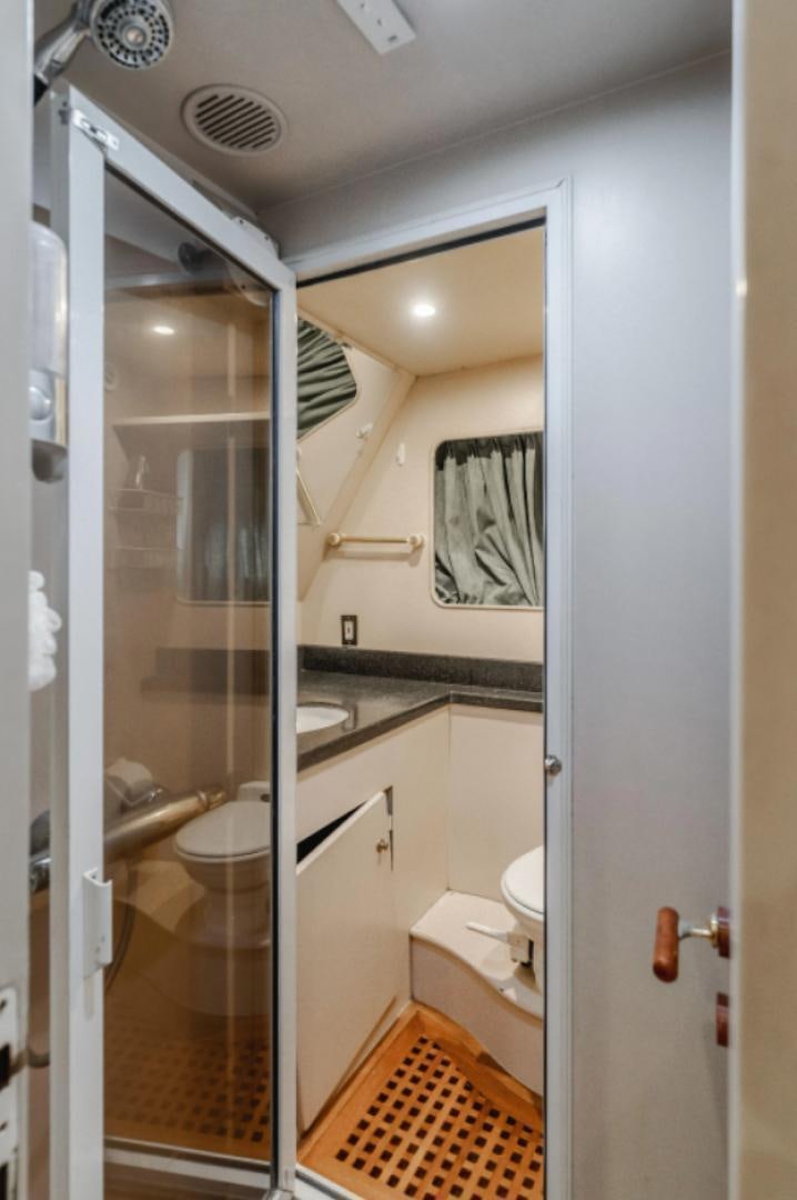 a bathroom with a glass shower aboard MARBELLA Yacht for Sale